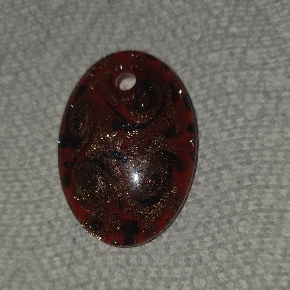Swirling Red and Black Oval Pendant